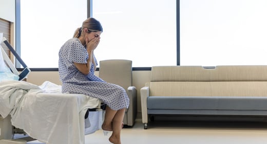 GettyImages-1406085163-sad-hospital-woman