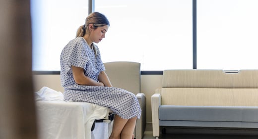 GettyImages-1406956159-woman-clinic-sad