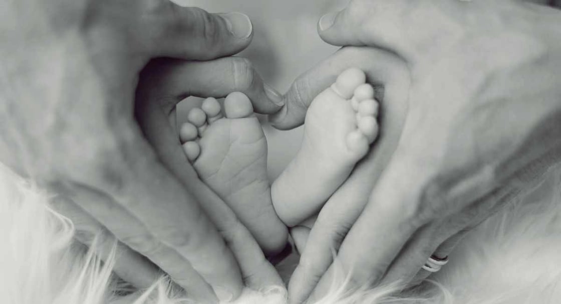 newborn-baby-feet-mother-father-hands-heart-pexels